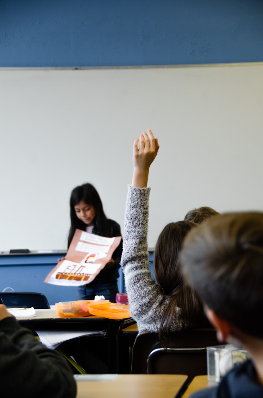 Classroom with student raising hand